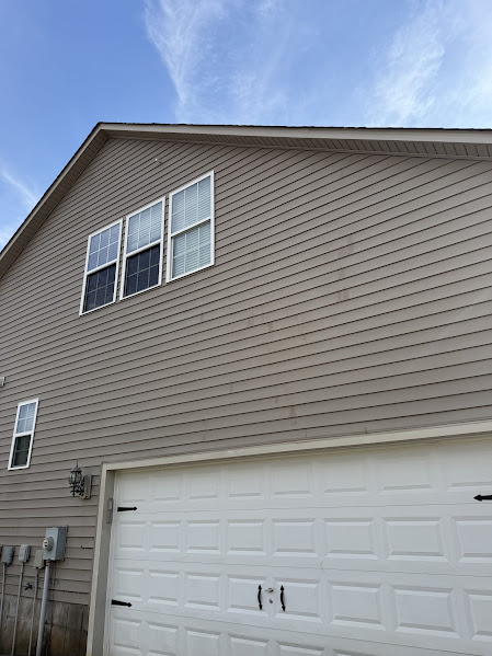 Garage door on a Charlotte, NC home before soft washing by CLT Property Detailing & Pressure Washing.