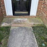 Moldy black stained and green algae stained walkway & entryway landing of a home in Huntersville, NC.