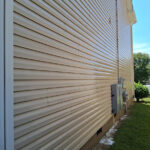 Clean siding after pressure washing away heavy mold and algae