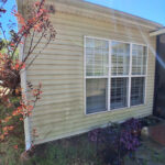dirty house siding before pressure washing in Charlotte