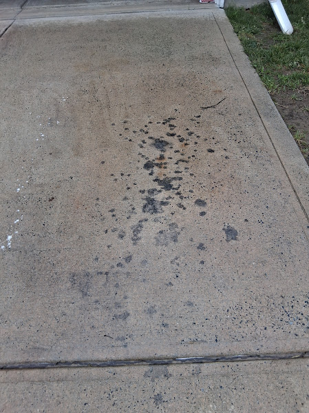 oil leak on a concrete driveway in Charlotte, NC